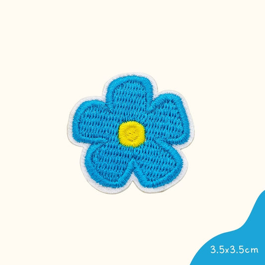 Funkey Monkey Bügelbild – Kleine Blaue Blume, ideal zur kreativen und festlichen Gestaltung von Kinderkleidung.